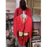 Two pink hunting coats together with hunting crop and hatLong tail coat: Collar to middle seam