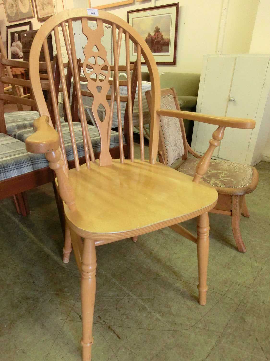 A modern beech wheel back open armchair