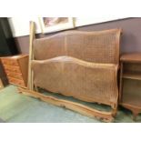 A wood and cane double bedsteadDimensions (Measured approximately as bed in pieces) :H: 112cm (