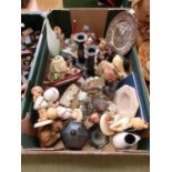 A tray containing candlesticks, cottages, ceramic figures, etc