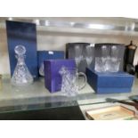 A selection of Waterford and Edinburgh crystal ware to include decanters, glasses, flutes,