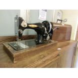 A cased BSM manual sewing machine