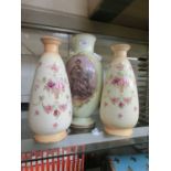 A pair of early 20th century Devonware vases of floral design together with an early 20th century