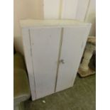 A white metal painted two door cupboard