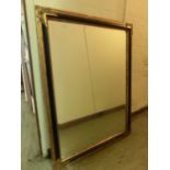 A reproduction gilt framed rectangular wall mirror of large proportions
