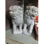 A pair of painted stoneware foo dogs