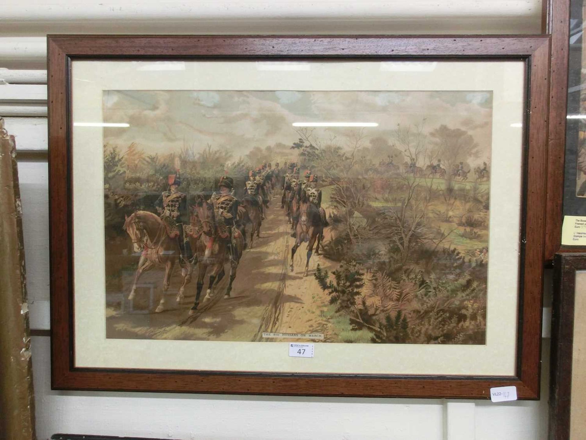 A framed and glazed print titled 'The Eighth Hussars On March'