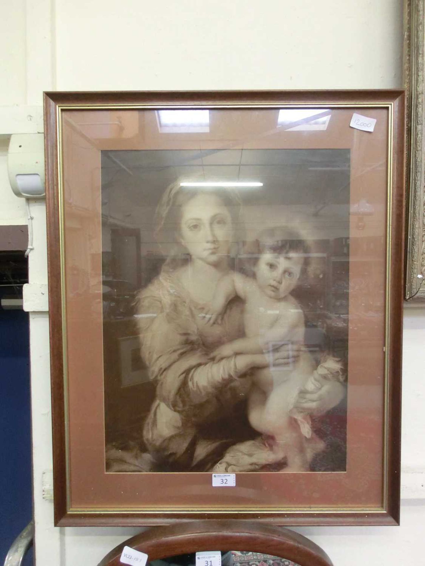 A framed and glazed monochrome print of Madonna and child