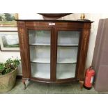 An Edwardian mahogany, marquetry, and boxwood strung bow front display cabinet