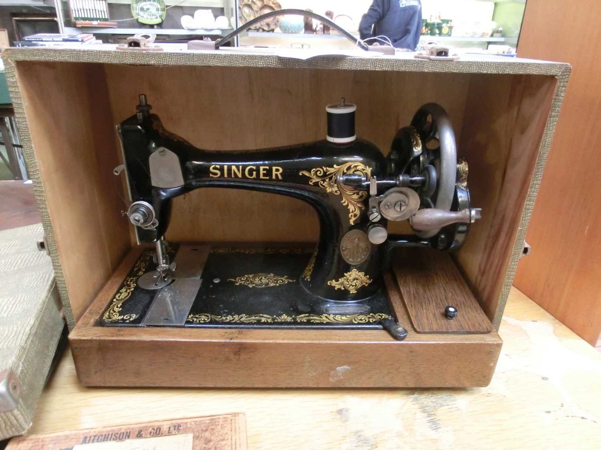 An early 20th century cased manual Singer sewing machine