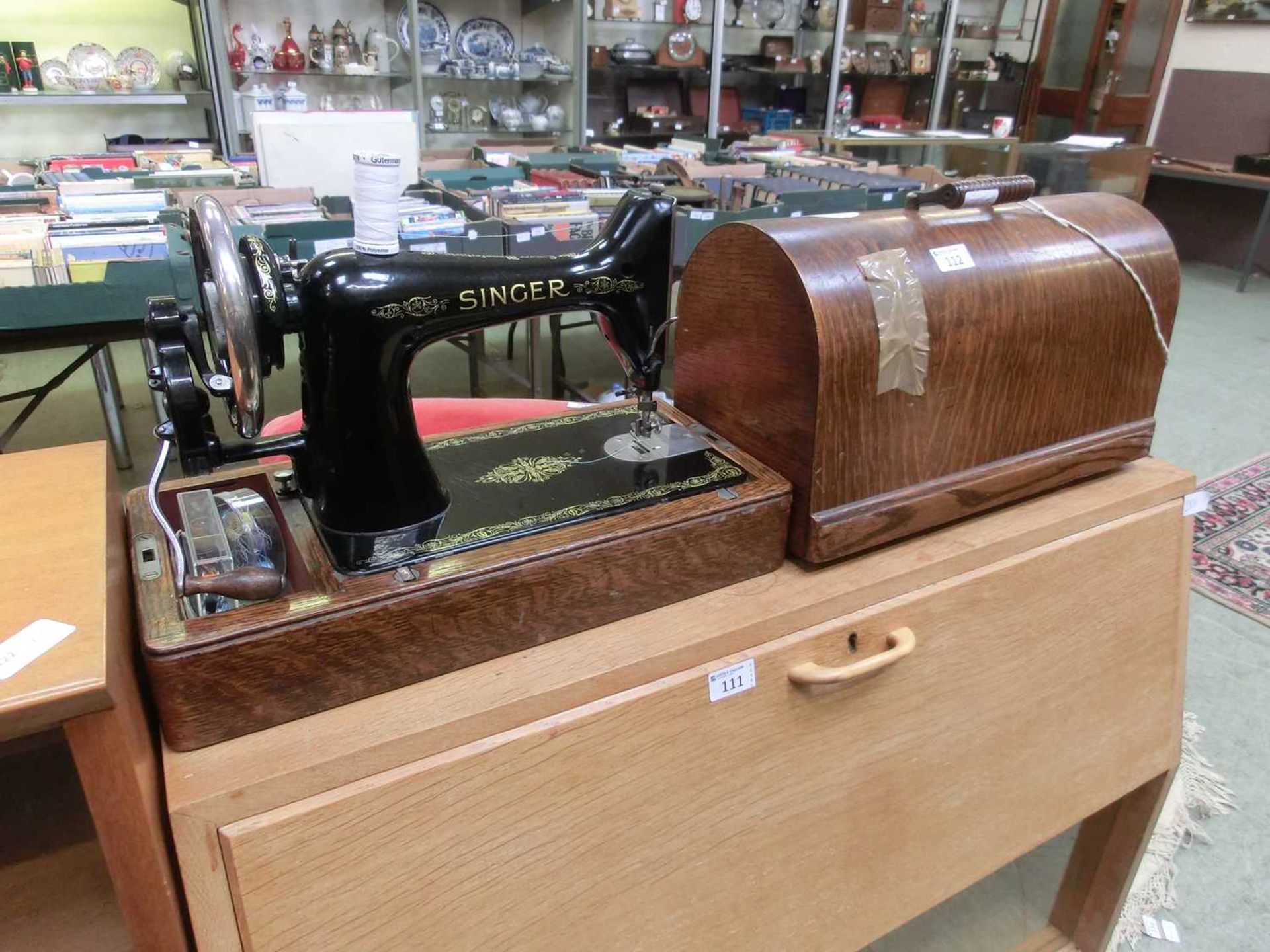 An oak cased early 20th century manual Singer sewing machine