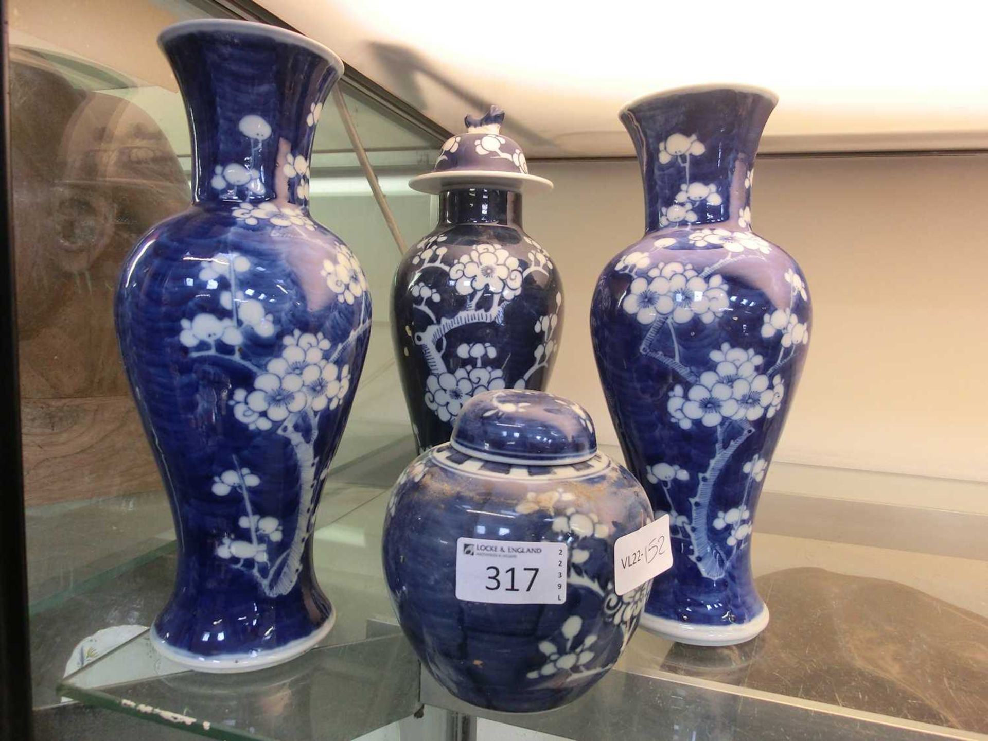 Three blue and white oriental style vases along with a similar ginger jarSmall chip to rim of one