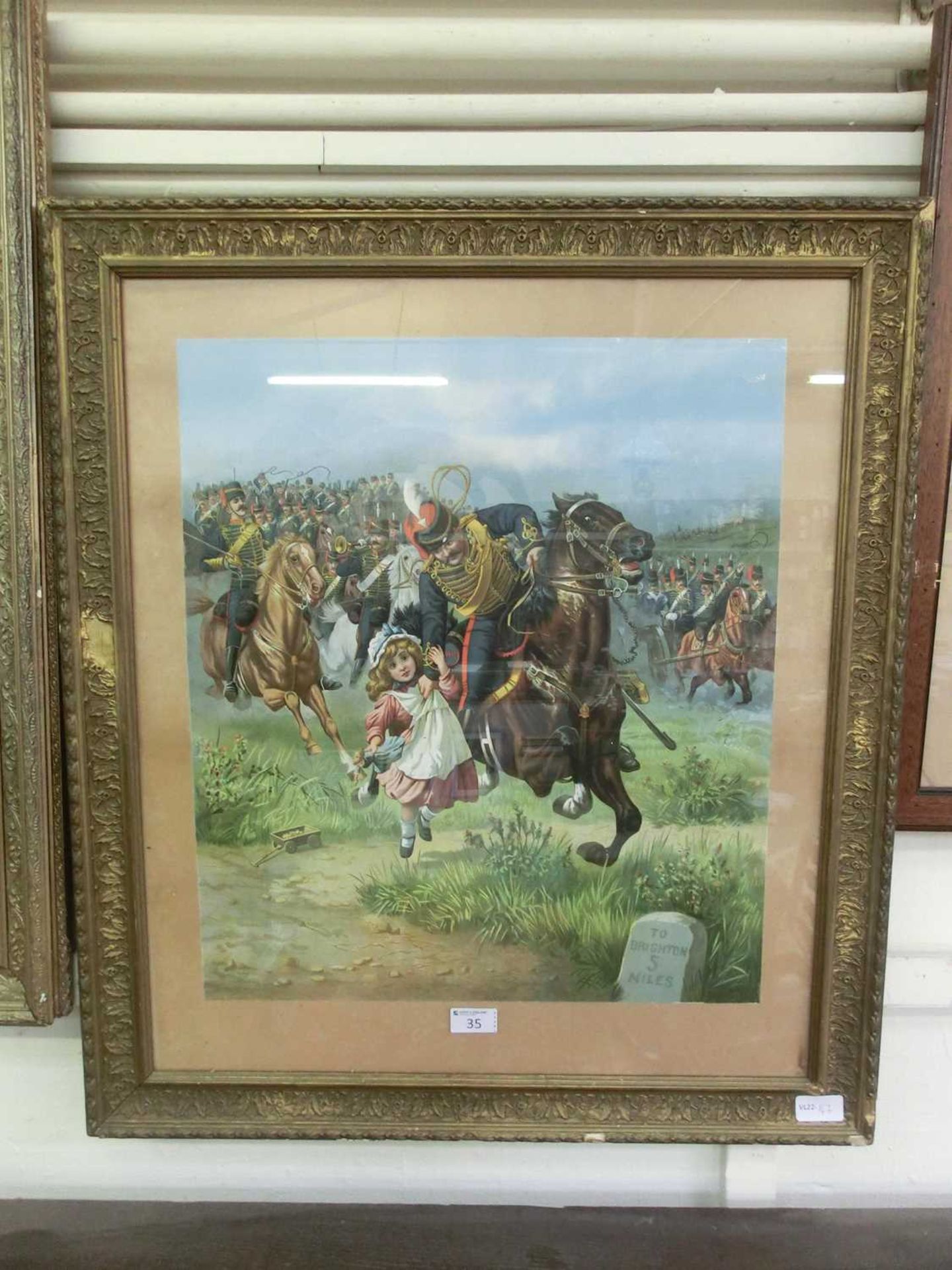 A gilt framed and glazed 19th century print of military horseman rescuing young child