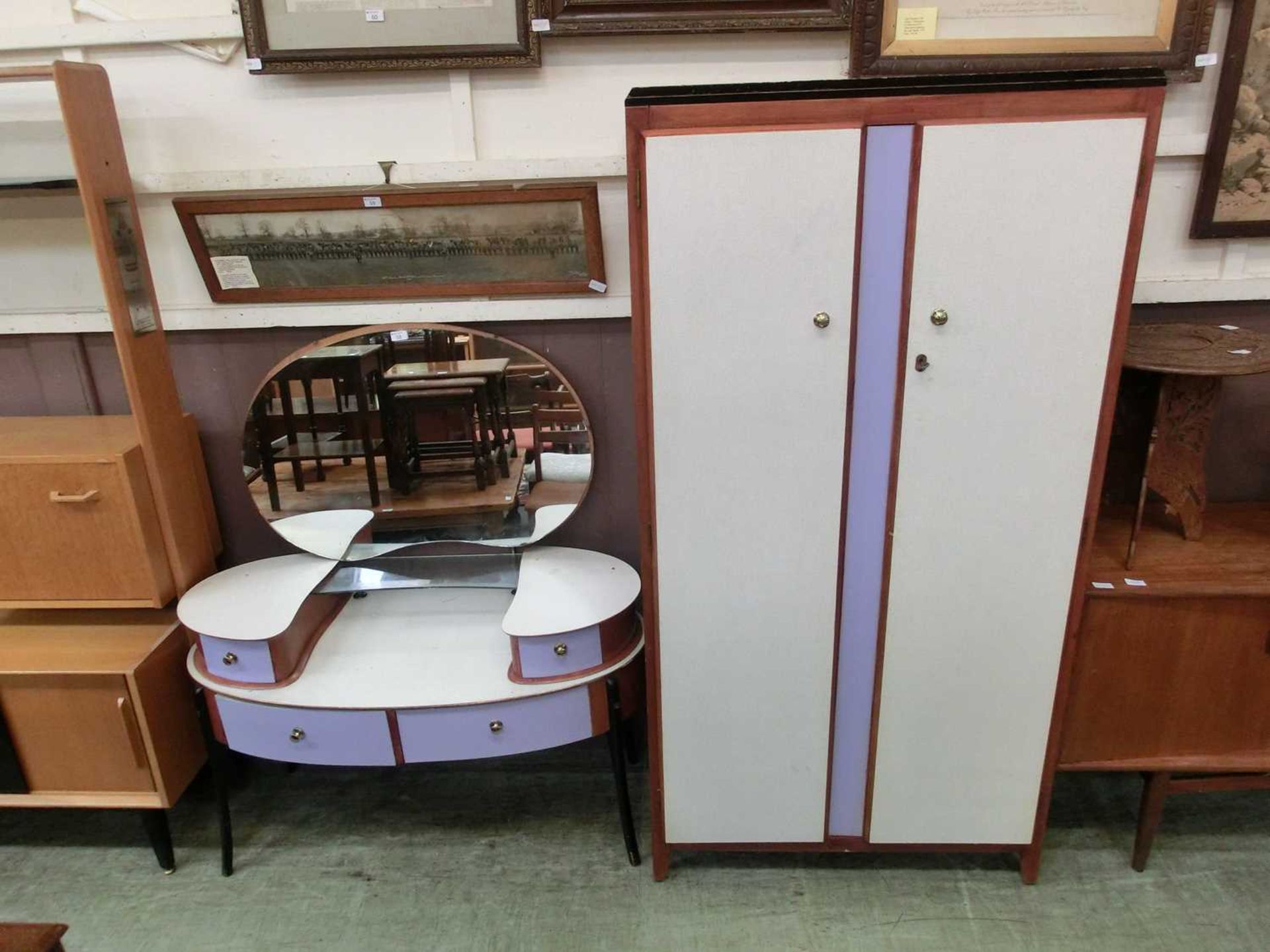 A mid-20th century Formica topped dressing table with purple painted drawers together with a similar