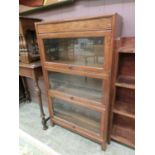 An early 20th century oak sectional bookcase