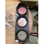 +VAT A modern three piece wall clock in the form of traffic lights