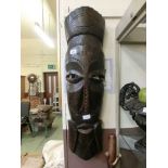 A large carved wooden African mask