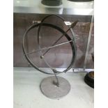 A cast metal armillary sundial