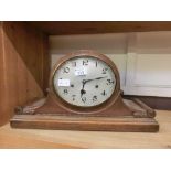 An early 20th century oak cased Napoleon mantle clock