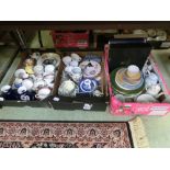 Three trays of ceramic ware to include plates, cups, saucers, vases etc.