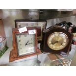 Three early 20th century clocks, one being bakelite