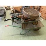 Two galvanised wheelbarrows together with a selection of hand tools and garden sieves