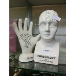 A phrenology head marked to base 'Phrenology by L.N.Fowler' along with 'The Hand'