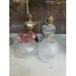 Two oil lamps along with shades