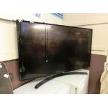 An LG flat screen TV with remote