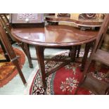 An early 20th century mahogany drop-leaf table