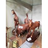 A Royal Doulton matte bay rearing horse together with a Beswick matte brown horse, and a glazed