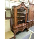 A modern burr walnut Dutch style display cabinet, single glazed door over the base with six