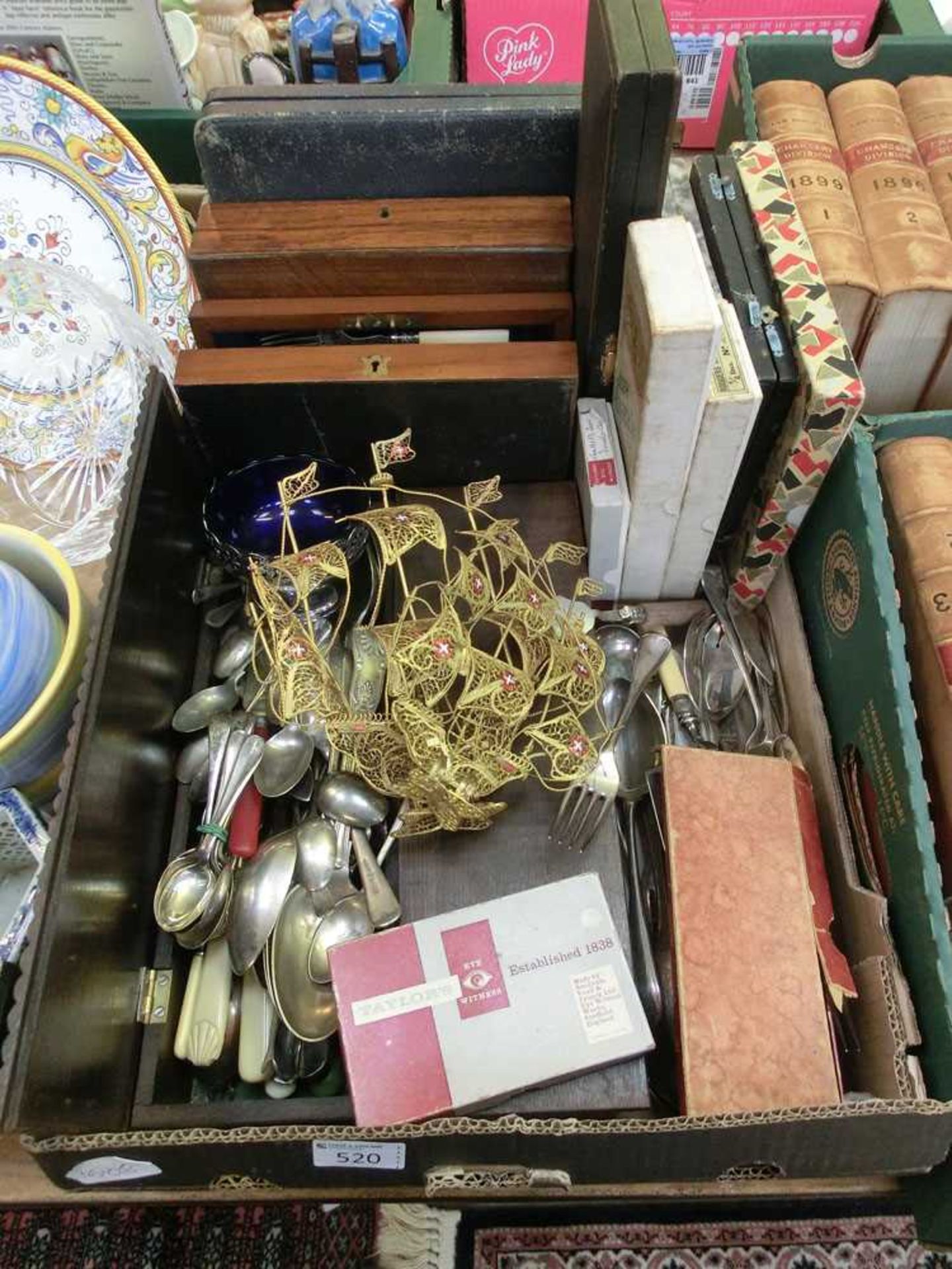 A tray containing a large quantity of cased and uncased flatware