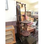 A mahogany four tier folding cake stand