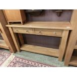 A modern oak two drawer hall table with under tier