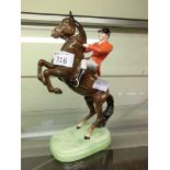 A Beswick model of huntsman riding horse