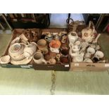 Three trays of ceramic ware to include tea pots, storage jars, German steins etc.