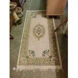 A rectangular cream ground rug