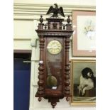 An early 20th century walnut cased Vienna style drop dial wall clock