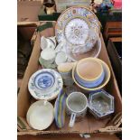 A tray of assorted ceramic ware to include cups, saucers and bowls