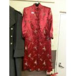 A red silk oriental style jacket with floral needlework