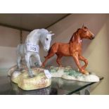 A Beswick ceramic horse on plinth together with a chestnut Beswick horse on plinth