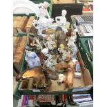 A tray containing assorted moulded and ceramic figures to include a Beswick dog