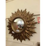 A mid-20th century gilt and plaster convex sunburst design mirror