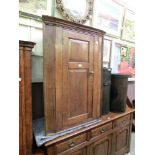 An 18th century oak wall hanging corner cupboard