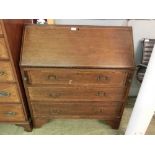 An early 20th century mahogany and tulipwood banded bureau