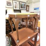 A mid-20th century walnut stool on cabriole supports