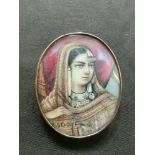 A yellow mounted framed miniature of eastern lady