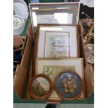 A tray containing an assortment of framed and glazed embroideries, maps etc.