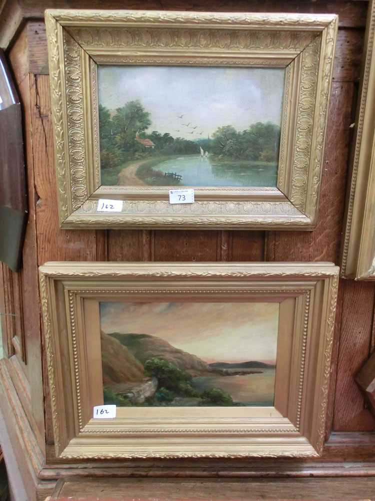 Two gilt framed oils on canvas, one of river scene, the other of mountainous lake scene